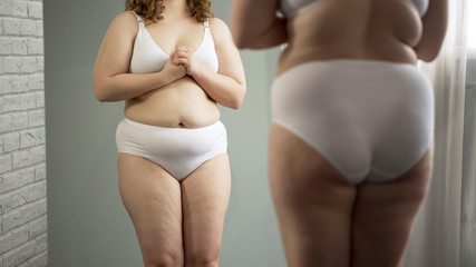 Cellulite and excess weight body of depressed overweight girl, insecurities