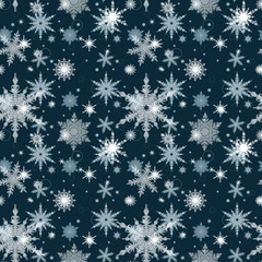 Seamless Christmas pattern. White snowflakes on a blue background.