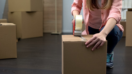 Office employee packing equipment and stuff for removal, business expansion