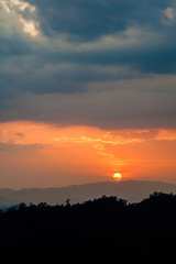 Beautiful sun silhouette at sunset mountain village in Chiang Mai