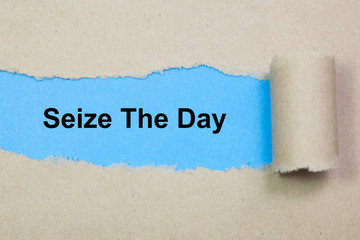 Seize The Day text on paper. Word Seize The Day on torn paper. Concept Image.