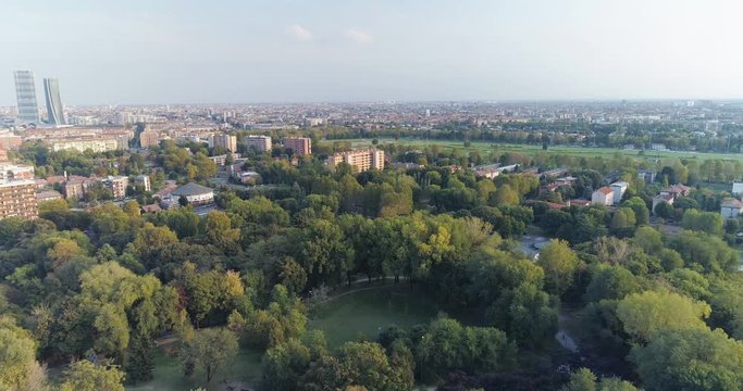 Aerial view of lake and city on a sunny day 4k