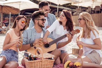 Friends having fun on the beach