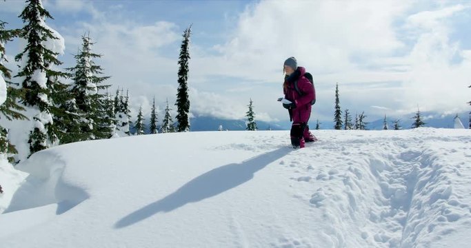 Woman with map walking in the snow 4k