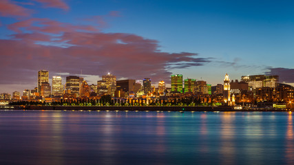 Fototapeta na wymiar Montreal city skyline over Saint Lawrence River at twilight with urban buildings, Montreal, Quebec, Canada