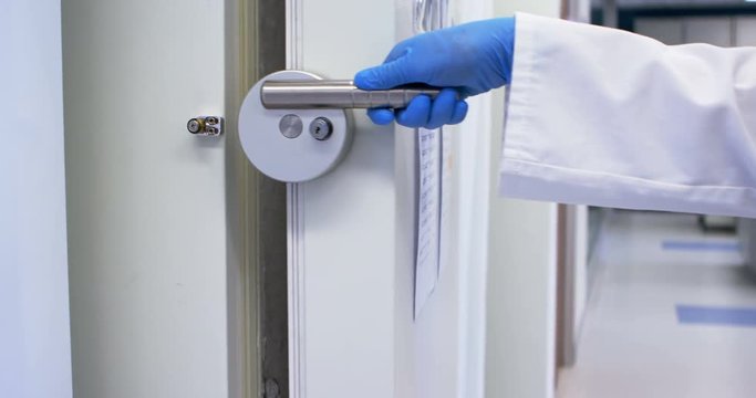 Scientist opening lab deep freezer in laboratory 4k