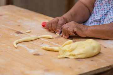 Orecchiette woman from Bari preparing the dough for orecchiette