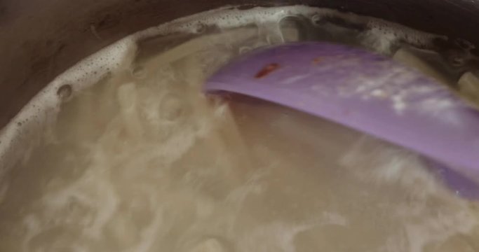 Mixxing Boiling Pasta, saucepan of boiling pasta closeup