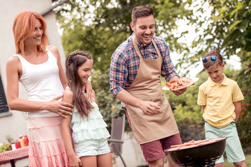 Happy family with barbecue