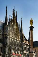 Fototapeta premium The clock tower of the new City Hall (Rathaus) in Marienplatz is a famous building in Gothic architecture - Munich, Bavaria, Germany, Europe