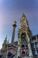 Fototapeta premium The clock tower of the new City Hall (Rathaus) in Marienplatz is a famous building in Gothic architecture - Munich, Bavaria, Germany, Europe