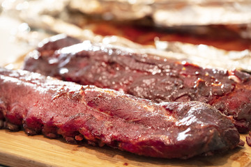 Barbecue Short Ribs with Sauce on a Cutting Board
