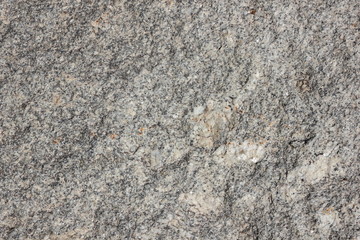 Granite background. Texture of gray granite stone. Natural pattern in gray tones. Abstract background