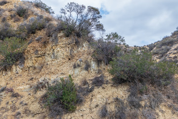 Gloomy clouds over dry hillsides ready for fall rain