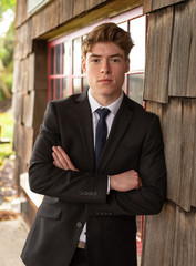 Teenage boy wearing dark suit