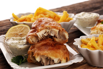 traditional British fish and chips consisting of fried fish, potato chips and mayonnaise