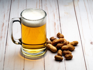 Beer mug and peanuts