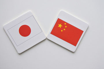 Japan and China flags on white background