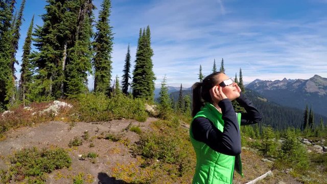 Woman using solar eclipse goggle 4k