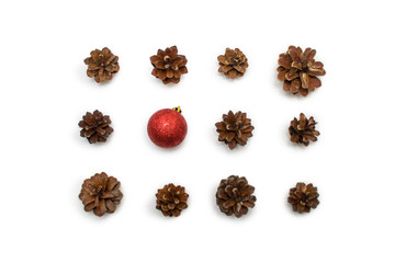 Christmas composition. pine cones, red and golden balls on white background. Flat lay, top view - holidays, winter and celebration concept -