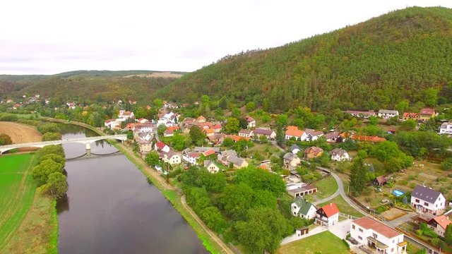 Camera flight over The Berounka river near Zbecno. Beautiful natural park in Czech Republic. European landmarks from above.