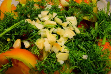 
Chopped garlic lies on top of the salad.