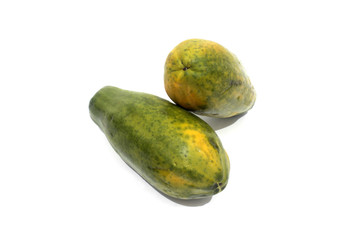 two fresh papaya fruits on a white background