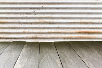 Wooden table backdrop against rustic metal