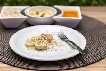 babana with honey and oats. Nutritious and healthy food