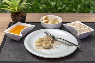 babana with honey and oats. Nutritious and healthy food