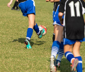 Close up action of youth girls soccer during a competitive match