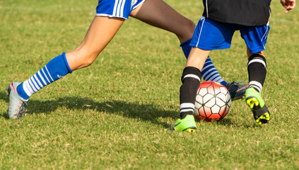 Fototapeta premium Close up action of youth girls soccer during a competitive match