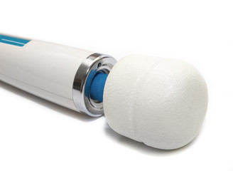 Massage for the body. Clitoral vibrator, intimate accessory on a white background. Close-up