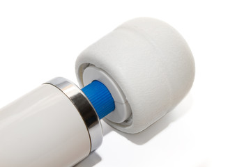 Massage for the body. Clitoral vibrator, intimate accessory on a white background. Close-up