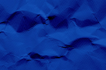 Deep Blue background and wallpaper by crumpled paper texture and free space.