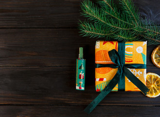 presents in orange and green paper on the wooden background  for friends and family. shopping,  New year and Christmas concept. close up