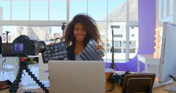 Model recording her video in photo studio 4k