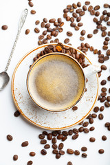 White Cup with cappuccino coffee on white wooden background. Top view. flat lay