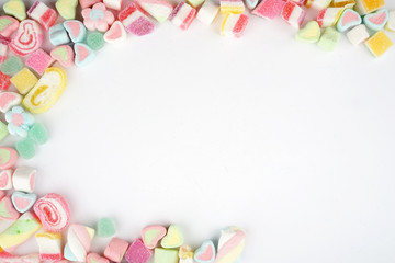 Creative arrangements of confectionery or candies on a white background. Flat lay.