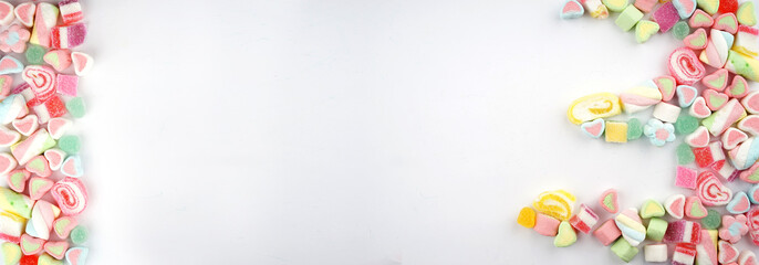 Creative arrangements of confectionery or candies on a white background. Flat lay.