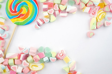 Creative arrangements of confectionery or candies on a white background. Flat lay.