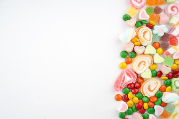 Creative arrangements of confectionery or candies on a white background. Flat lay.