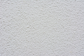 White or grey knobby cement wall texture  background.
