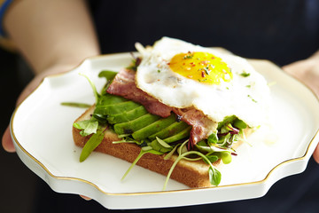 Bacon and avocado toast with fried egg