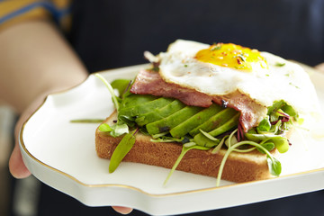 Bacon and avocado toast with fried egg