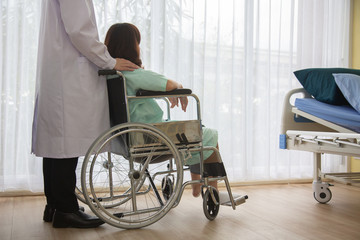 The doctor is taking care of the patient Disabled women is wheelchair in hospital.rehabilitation...