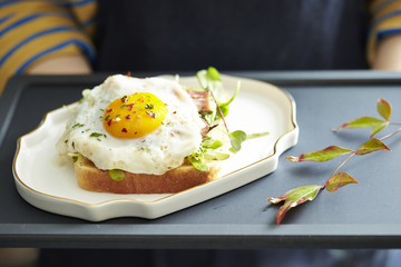Bacon and avocado toast with fried egg
