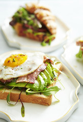 Bacon and avocado toast with croissant sandwich 