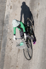 a cyclist riding a bicycle in the streets of Ho Chi Minh City