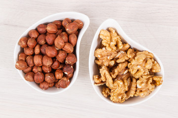 Hazelnuts and walnuts in bowl as source healthy vitamins and minerals, nutritious eating